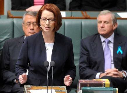Simon Crean (right) looks for a suitable place in Julia Gillard's back.
