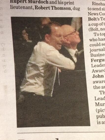 Tony Abbott kneels to Rupert Murdoch at the IPA birthday party.