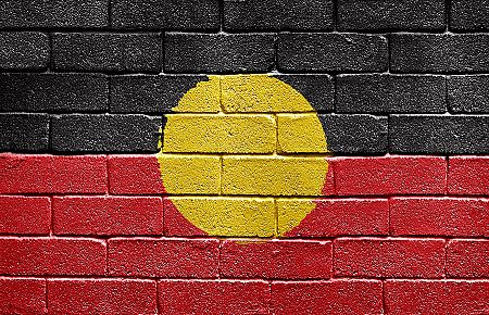 bigstock_Flag_Of_Aborigines_On_Brick_Wa_5249790