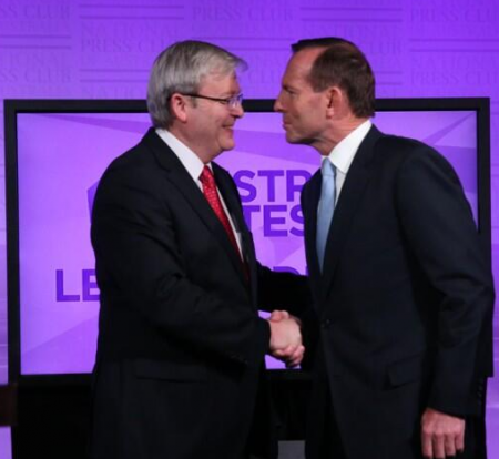 The telling handshake last night at the Leader's Debate: is Abbott about to headbutt Rudd or kiss him?