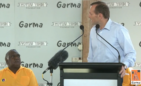 Tony Abbott looks across at Indogenous leader 